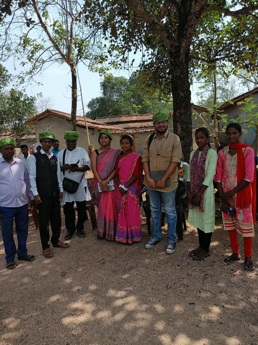 Team members with community members during a village visit
